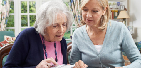 two women working to reduce credit card debt