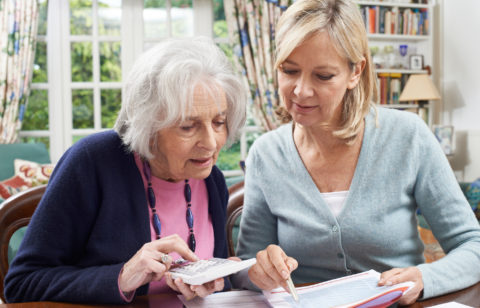 two women working to reduce credit card debt