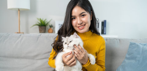 woman holding cat