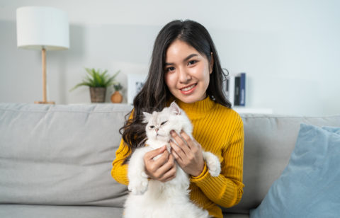 woman holding cat