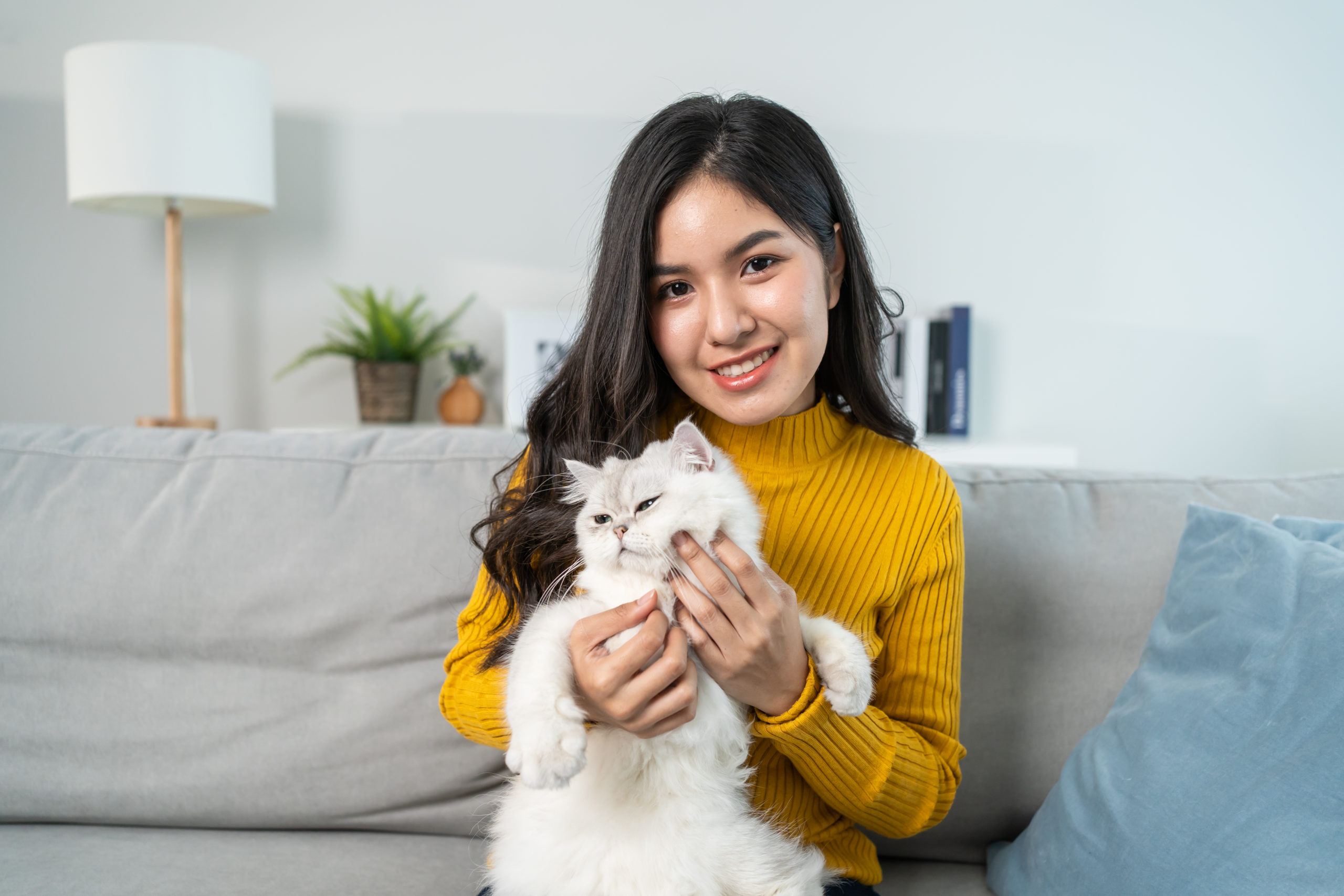 woman holding cat