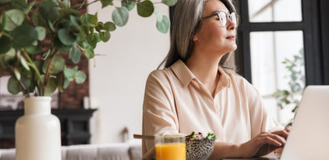 woman on laptop researching debt consolidation