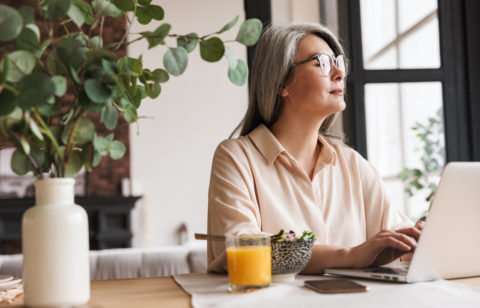 woman on laptop researching debt consolidation