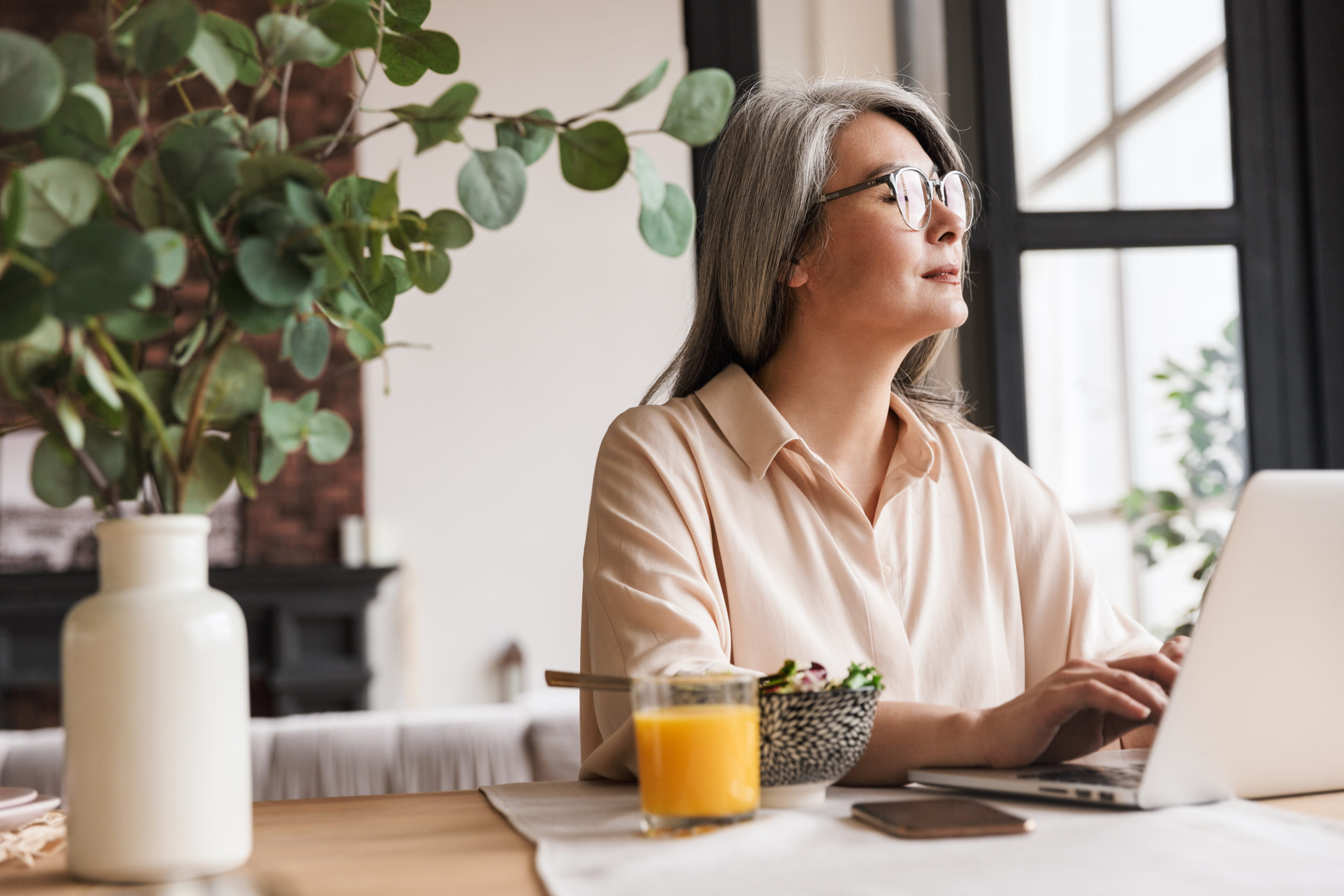 woman on laptop researching debt consolidation