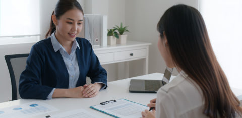 two women talking about credit card programs