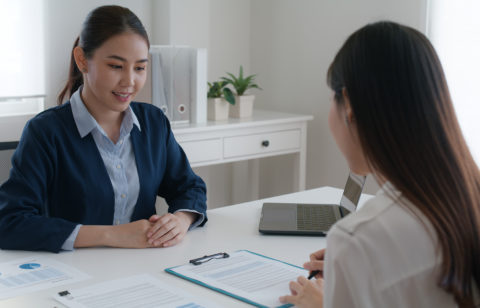 two women talking about credit card programs