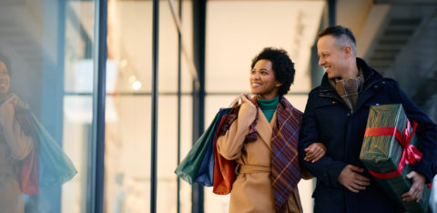 happy couple window shopping during the holidays