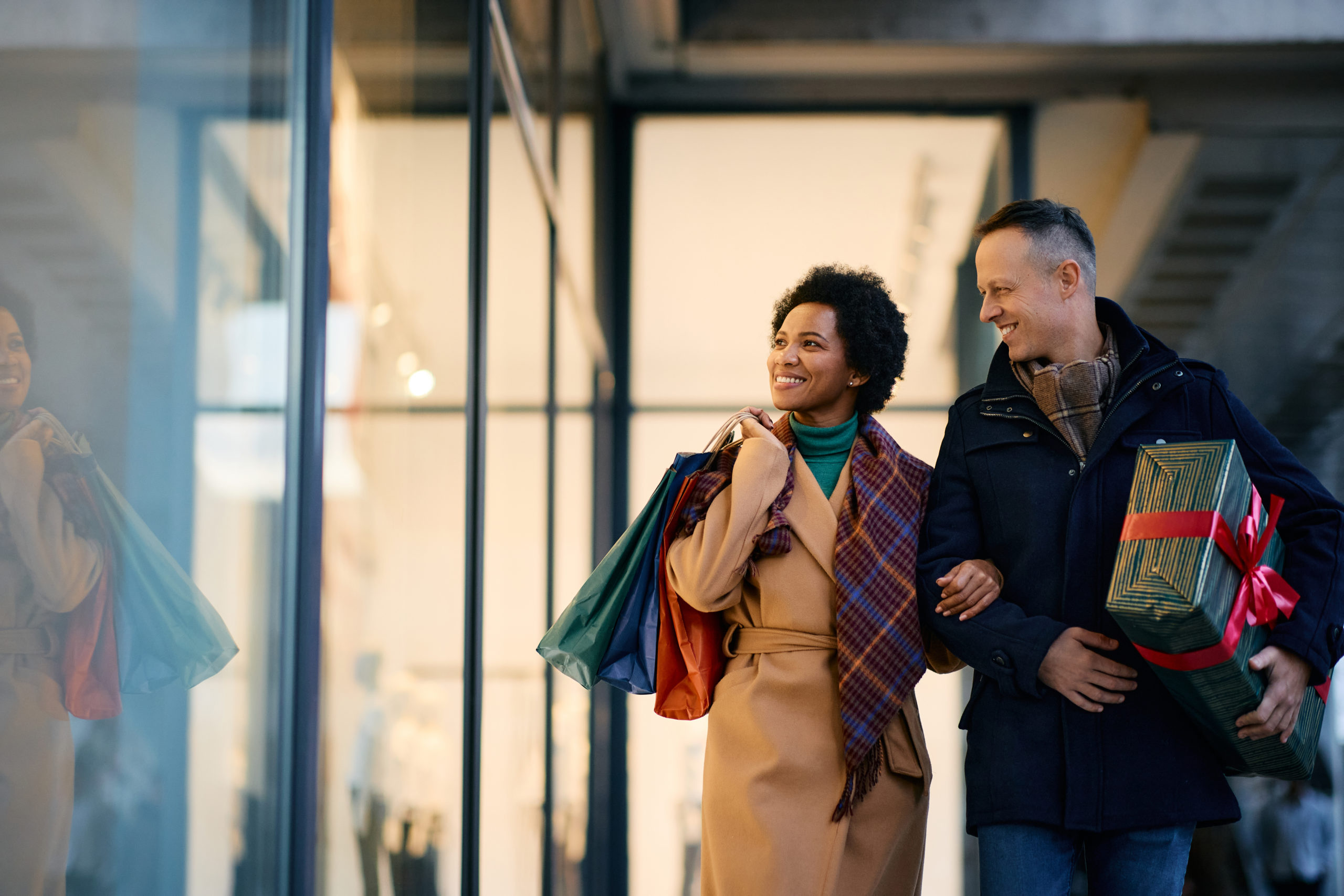 happy couple window shopping during the holidays