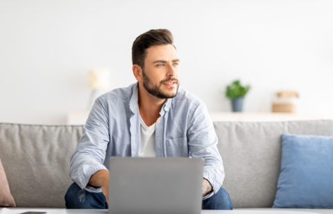 man thinking about paying off old debt