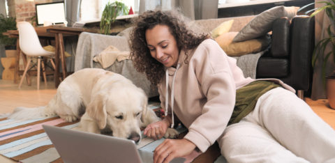 woman with a laptop researching the best ways to consolidate debt