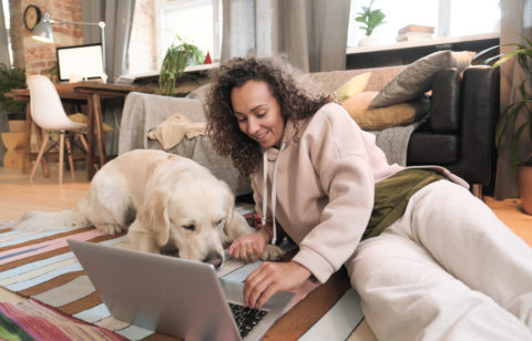 woman with a laptop researching the best ways to consolidate debt