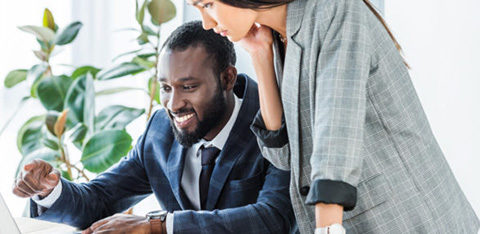 smiling african american businessman pointing on