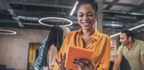 smiling african american girl with tablet