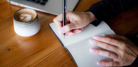 woman writing a list