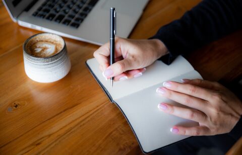 woman writing a list