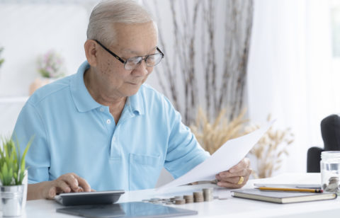 senior man looking at a tax refund