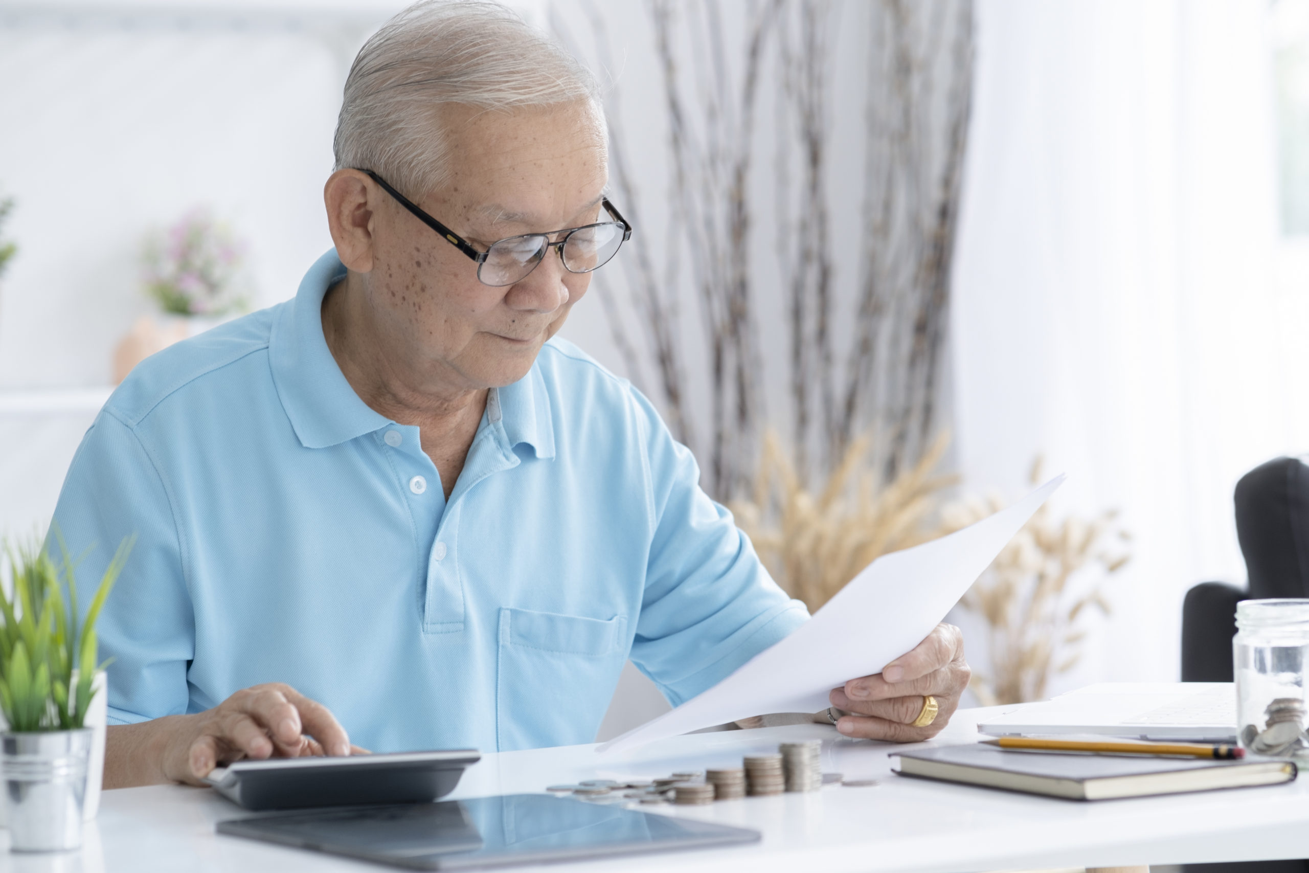 senior man looking at a tax refund