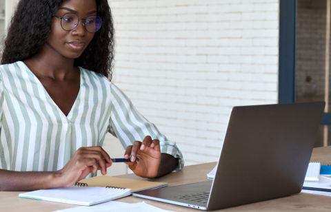 woman researching common tax types on her laptop