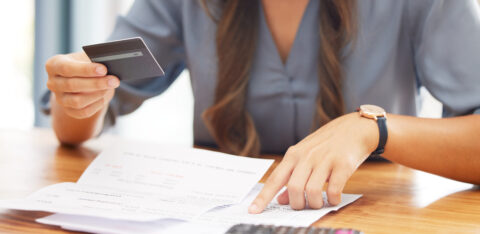 business owner holding a credit card