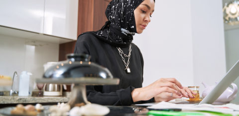 Self-employed woman claiming tax deductions on her laptop.