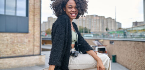 happy young woman on a urban background