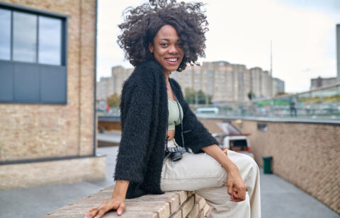 happy young woman on a urban background