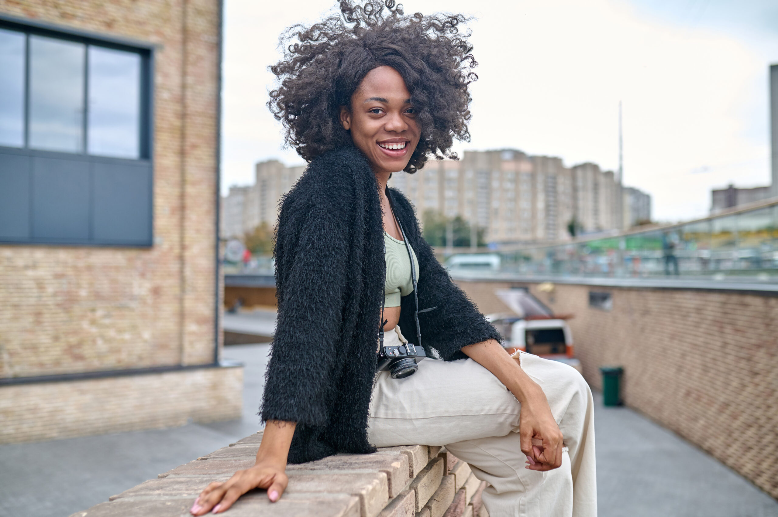 happy young woman on a urban background