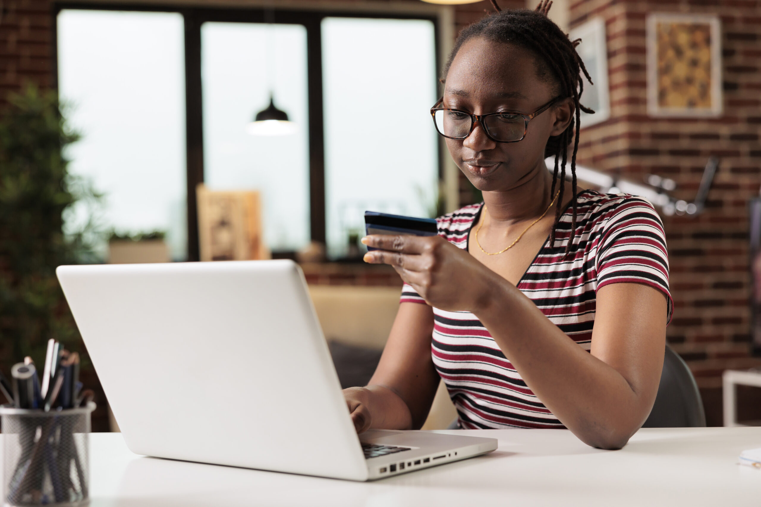 woman holding credit card making payment