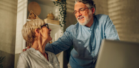 Senior couple researching 401k vs Roth IRA