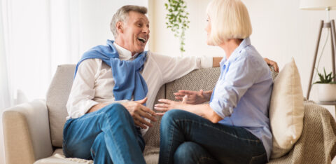 Retired couple discussing finances and debt