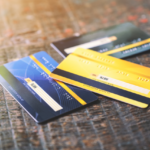 Several credit cards on wooden table