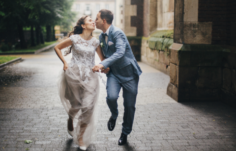 beautiful happy wedding couple smiling and kissing