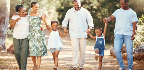 Black family hiking and bonding on a path