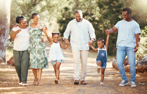 Black family hiking and bonding on a path