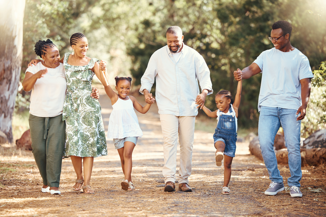 Black family hiking and bonding on a path