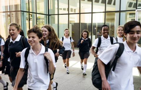 Group of students running at school